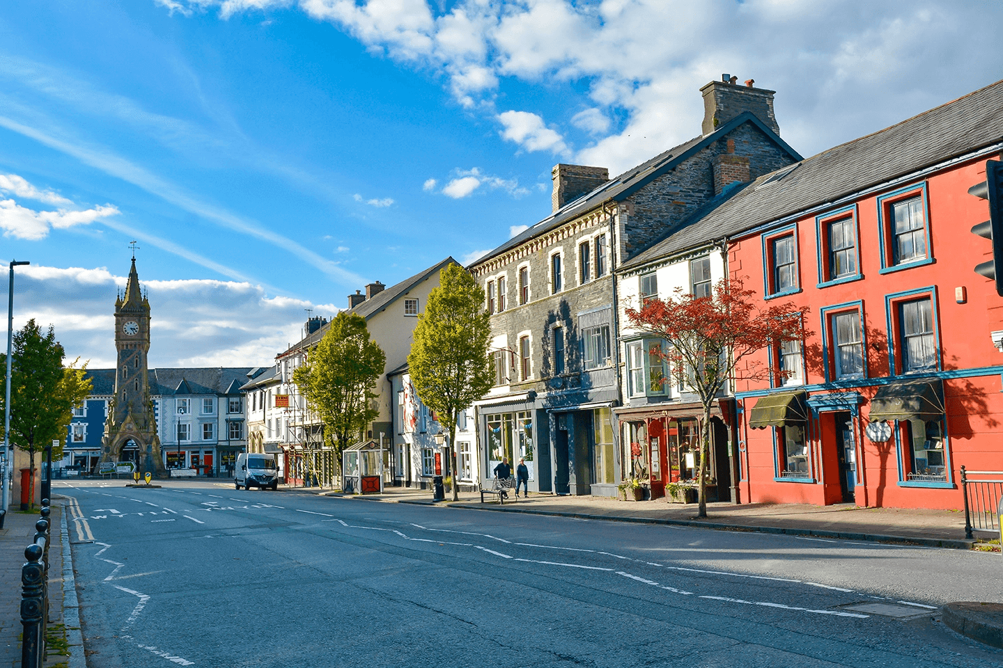 The charming high street of Machynlleth, Wales, with its colorful buildings and iconic clock tower